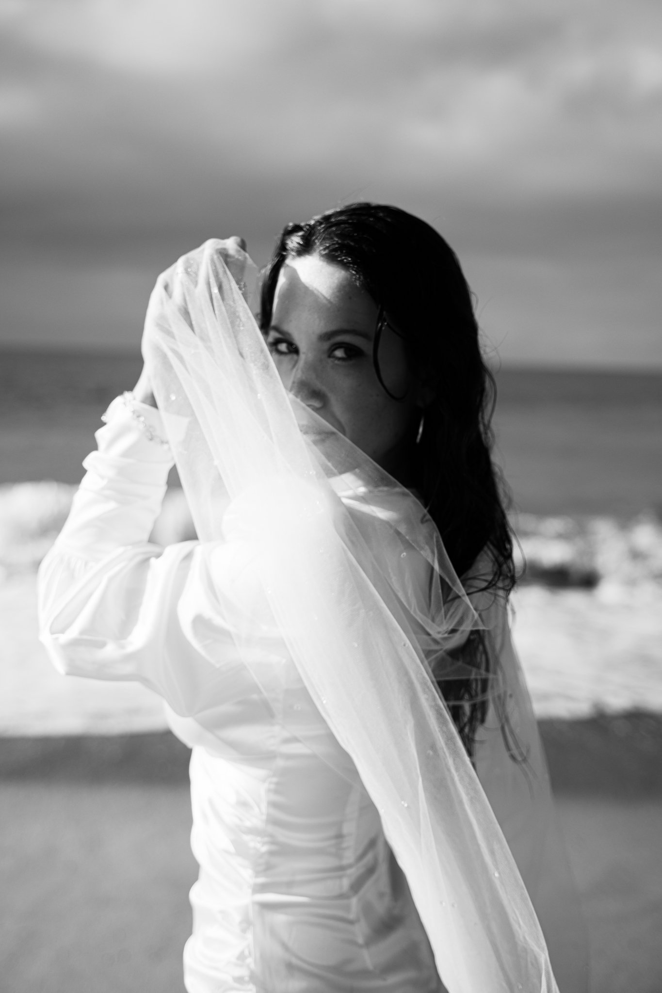 Bide at Malibu Beach, holding vail