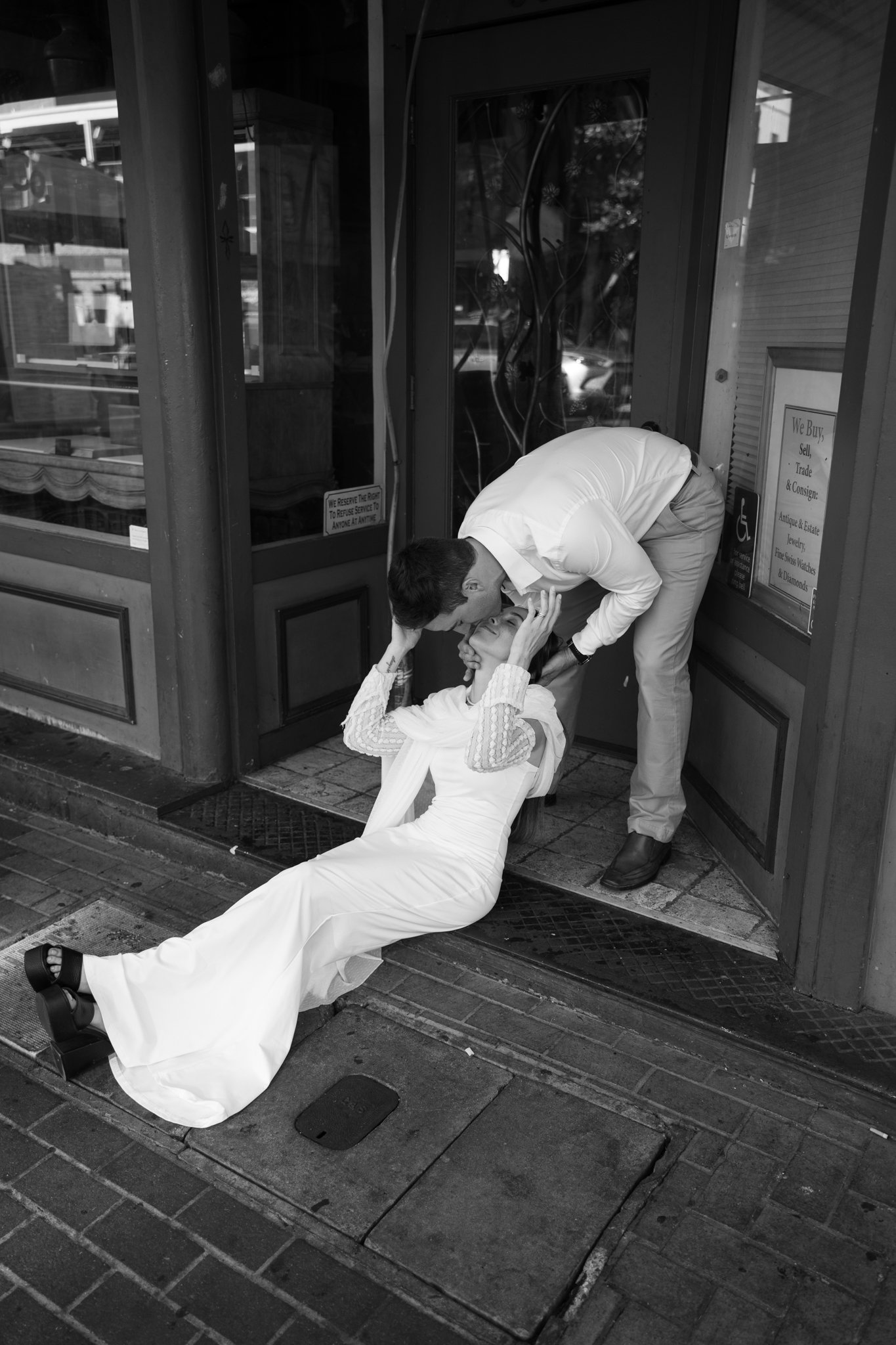 Bride and Groom Kissing on sidewalk in Downtown San Digeo