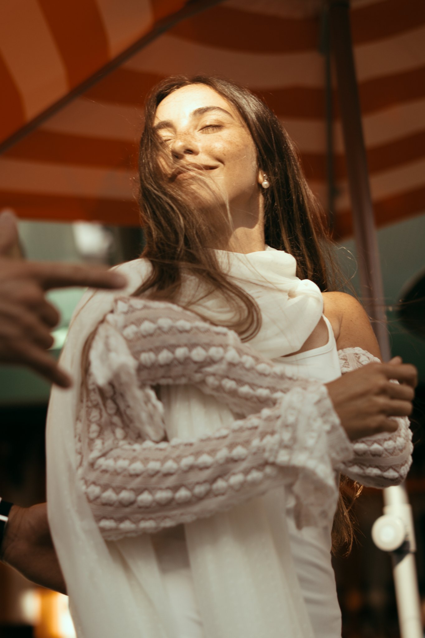 Male, turning around and catching sun
