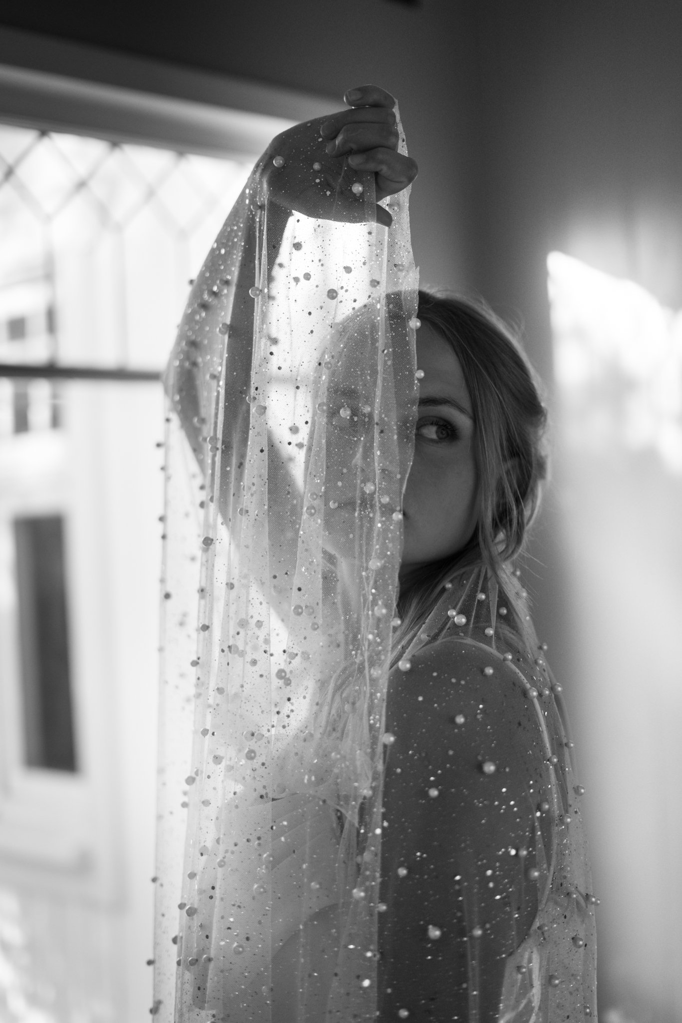 Woman holding up vail