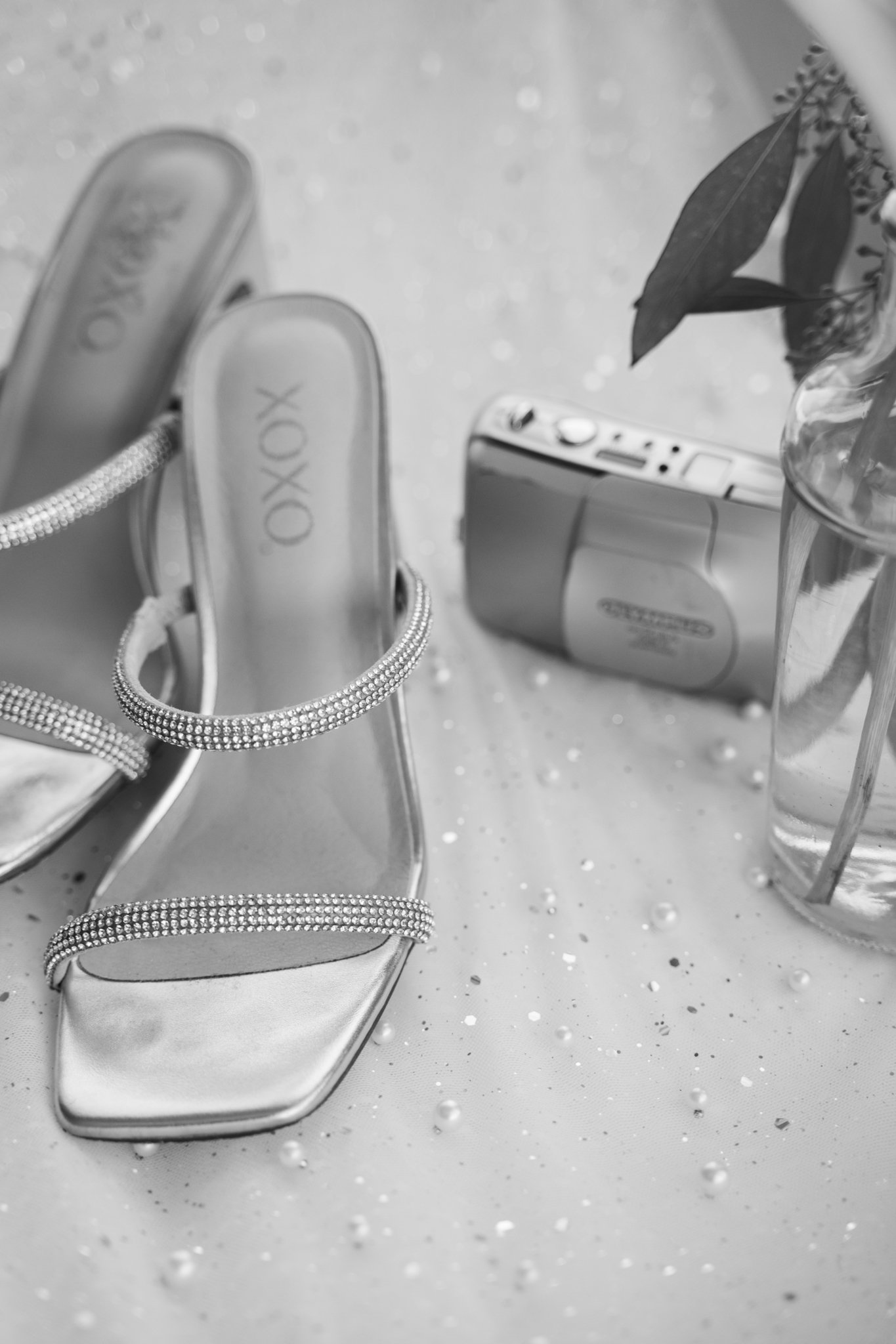 camera and shoes laying on table