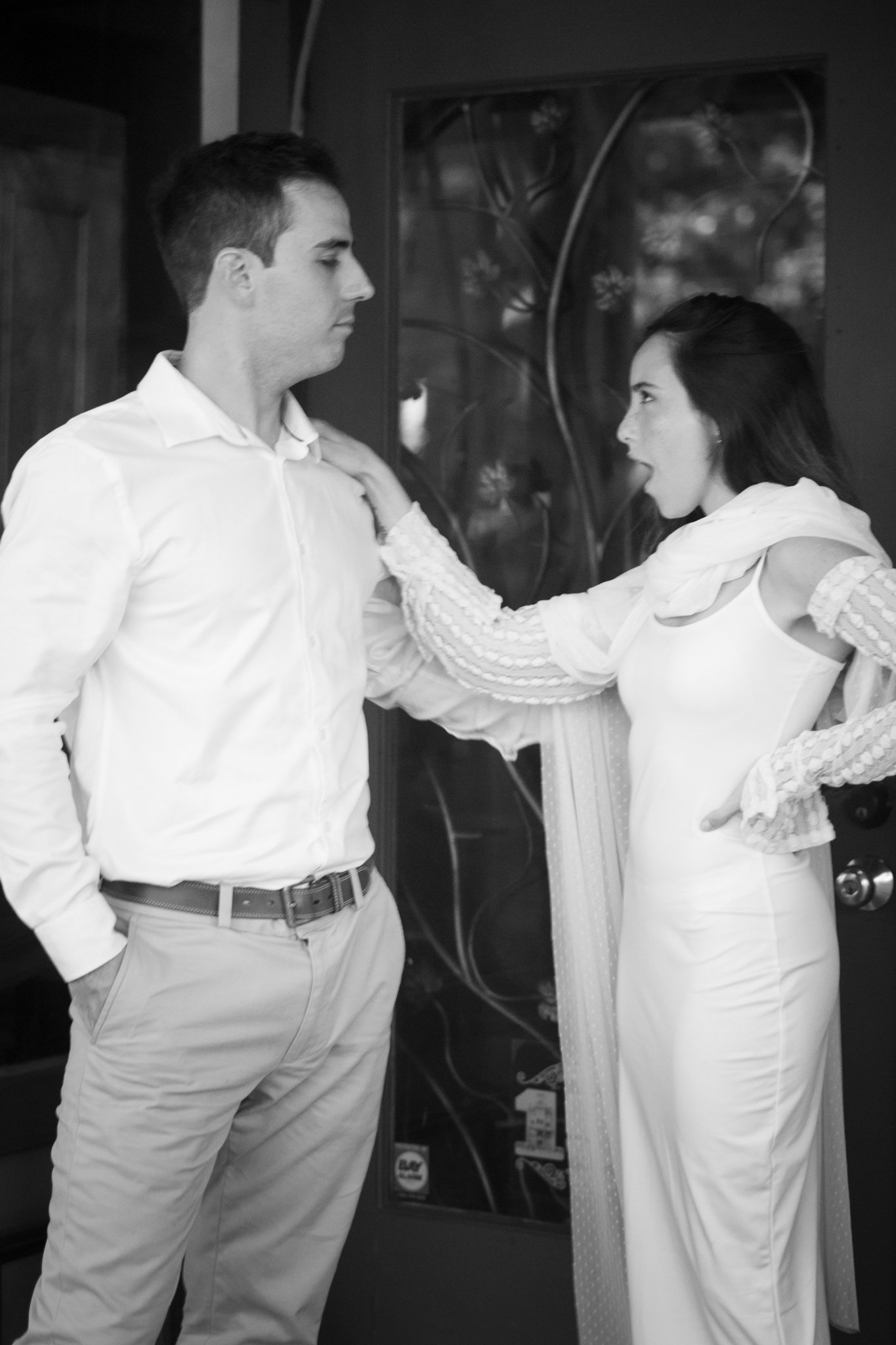 Male and Pedro infront of Door in Downtown San DIgeo on their Weddingday