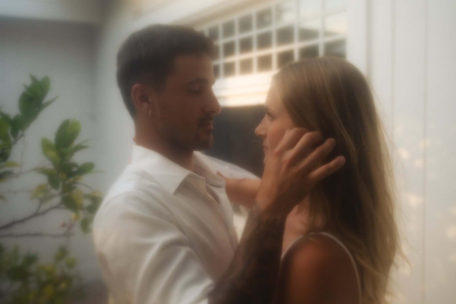 Man touching Womans face gently