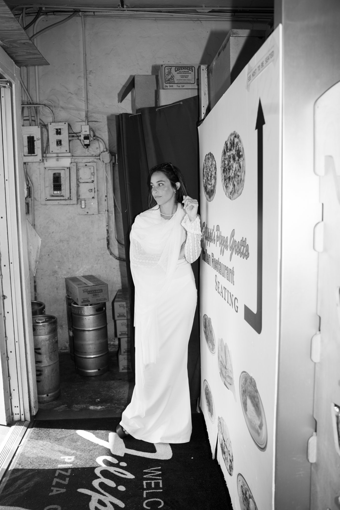 Bride in Doorstep to the Store in Little Italy,. San DIgeo on her Weddingday