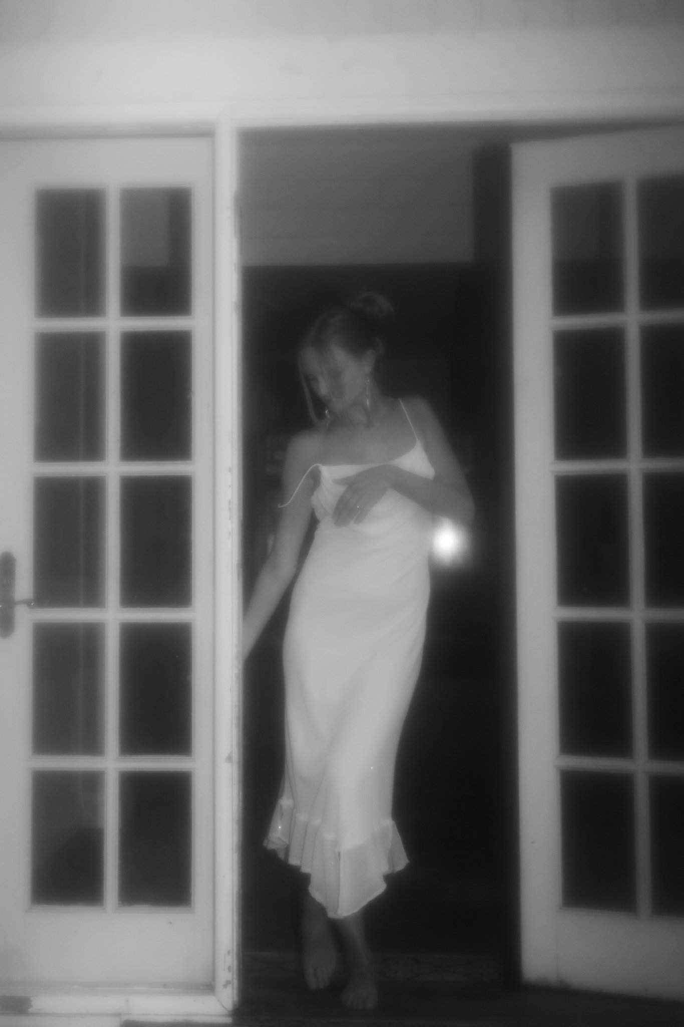 Woman standing in doorswell.