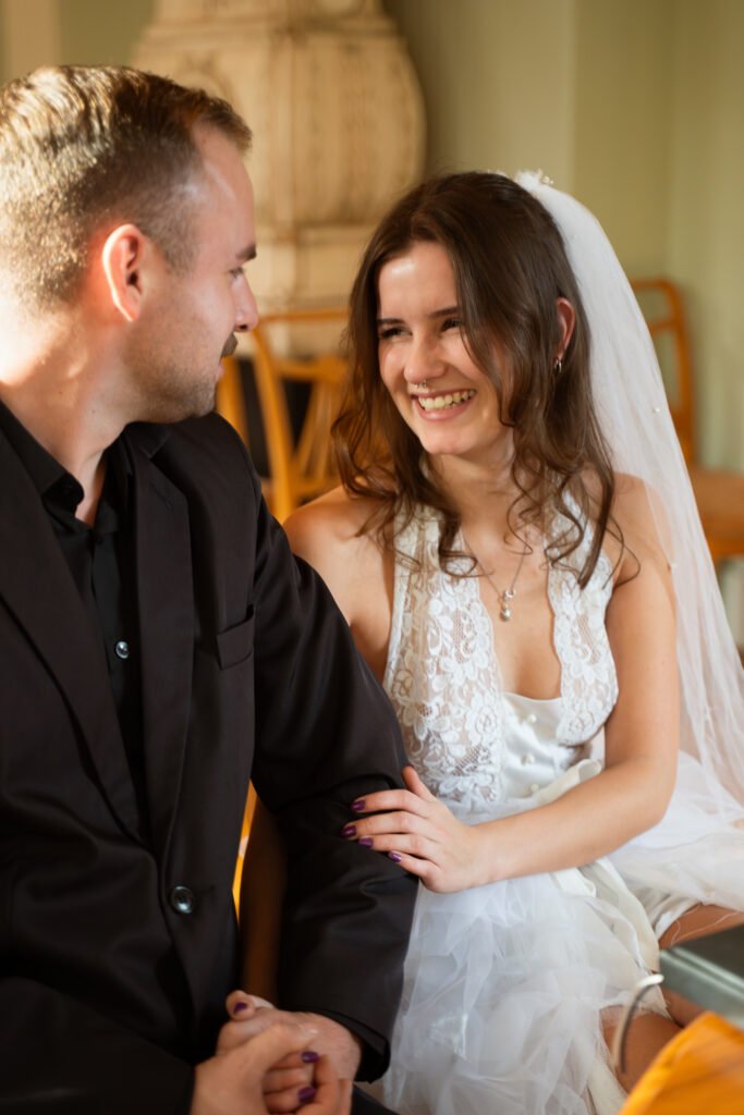 bride is looking at her groom, right before saying her vows