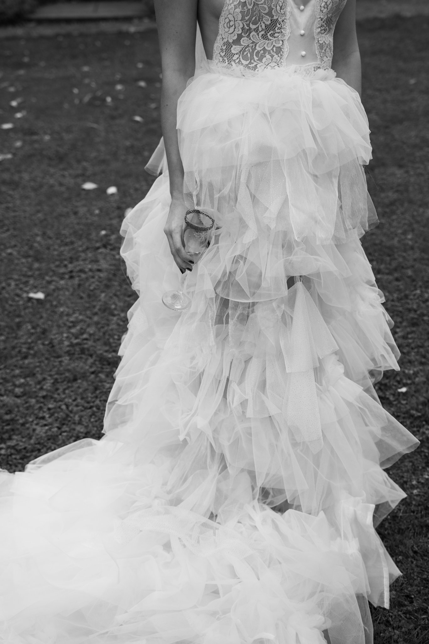 Details of the dress, and Clara is hloding her glass