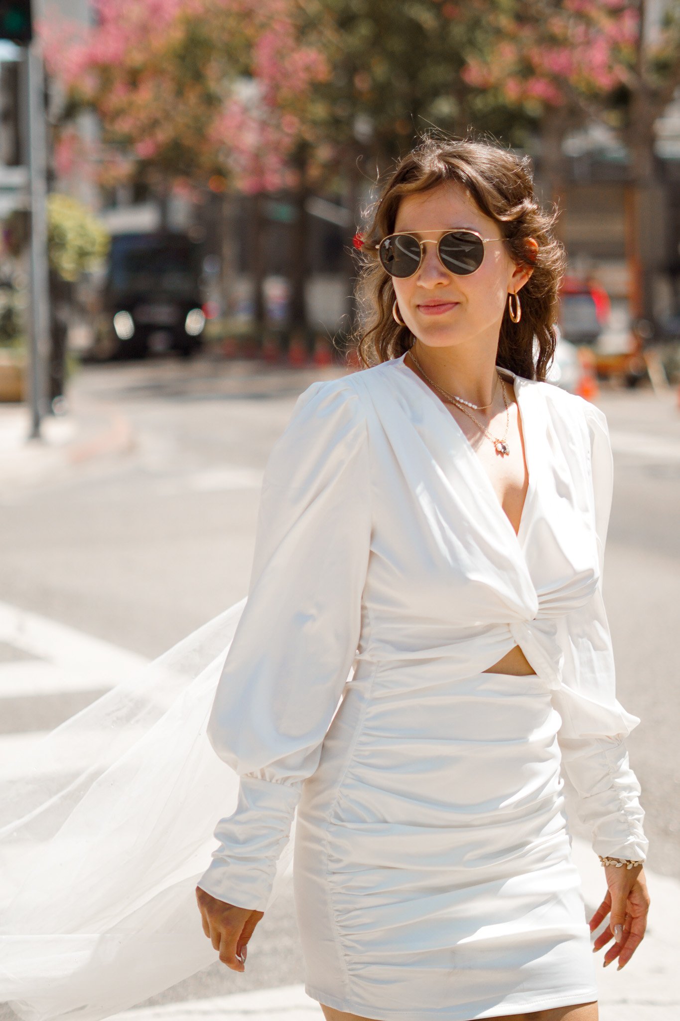 Woman in weddingdress and sunglasses