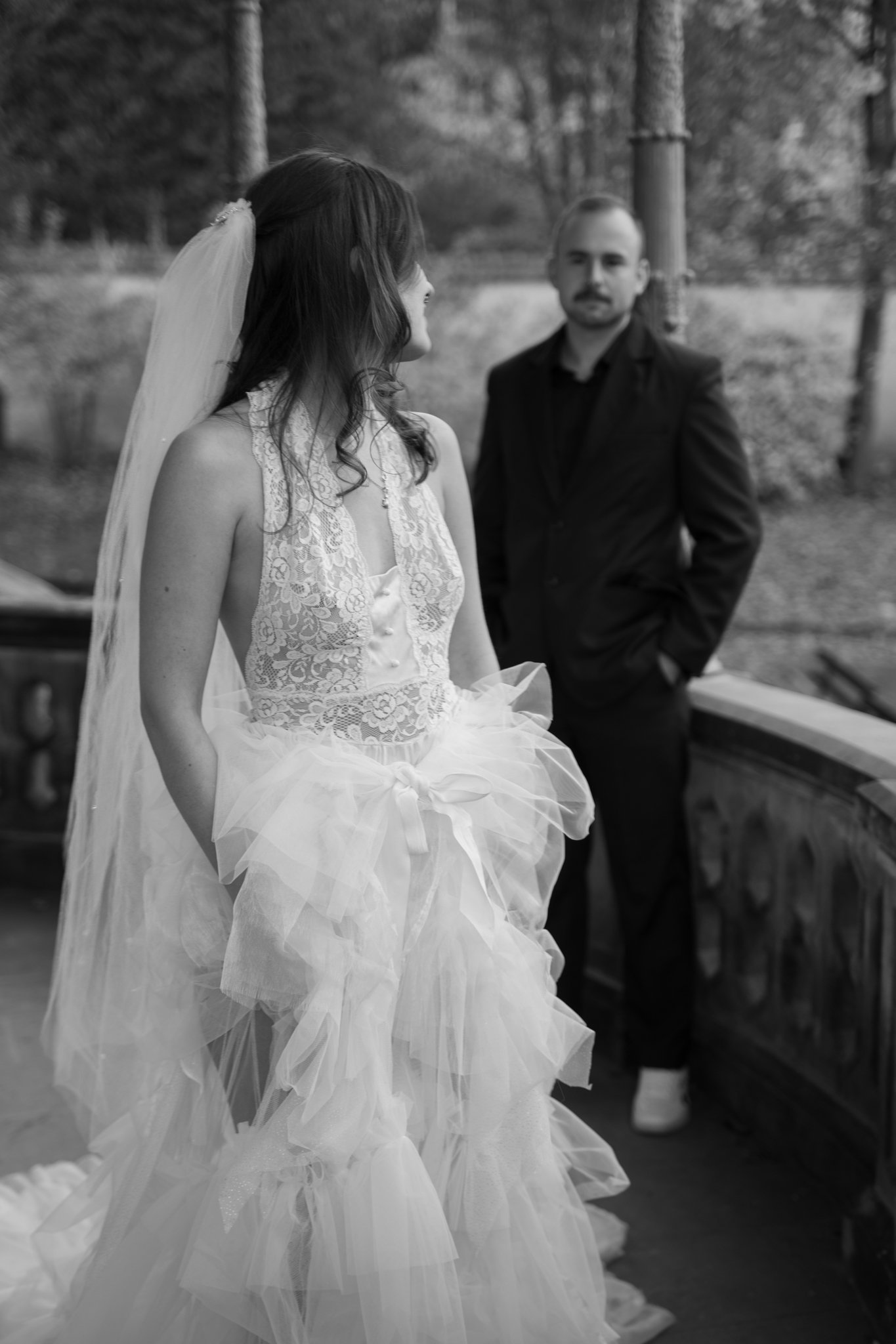 Clara looking back to her husband, walking to camera