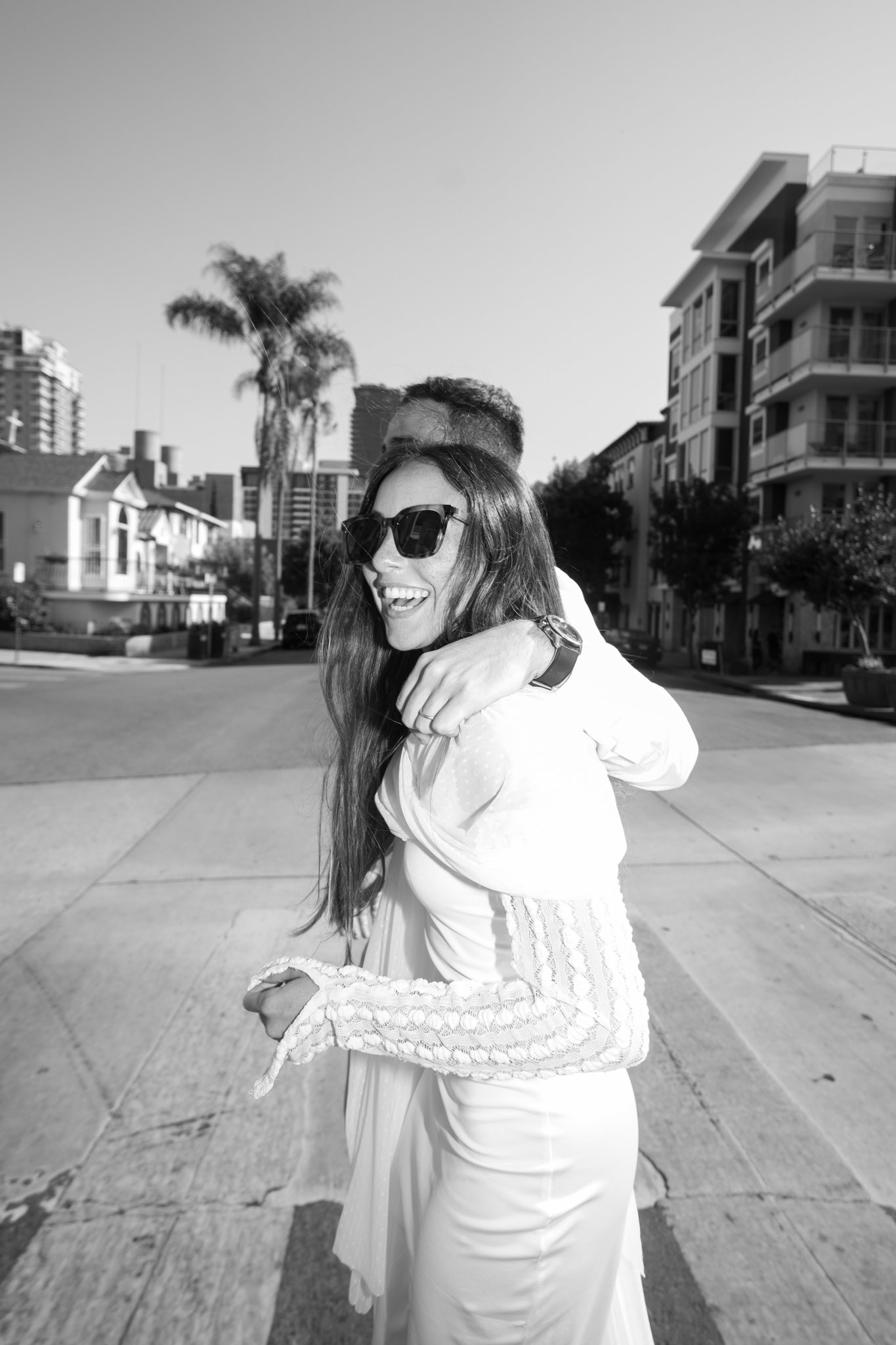 Male and Pedro on street, bride laughing