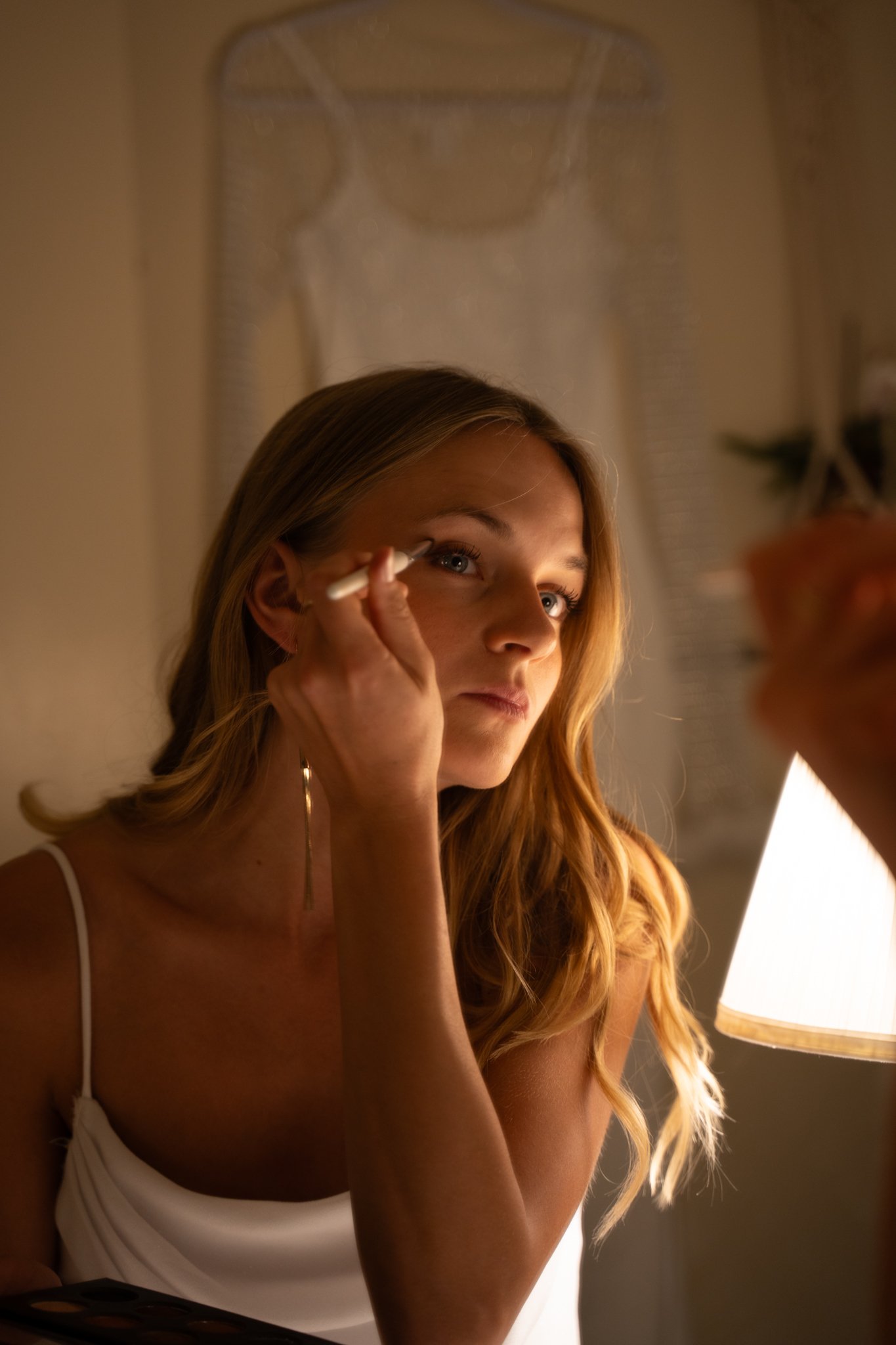 Woman looking on mirrow and gtting ready