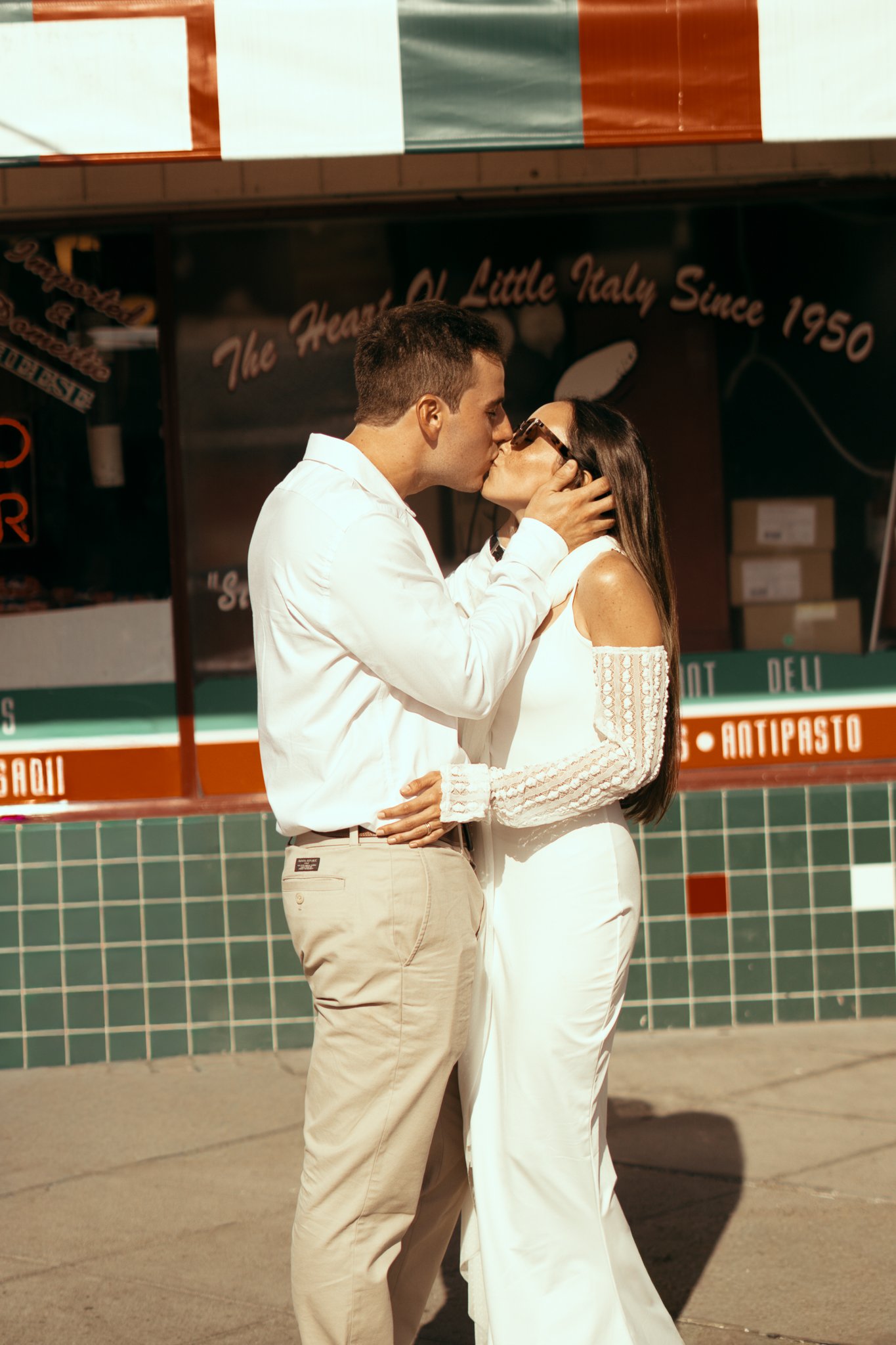 Groom holding Brides face and kissing her