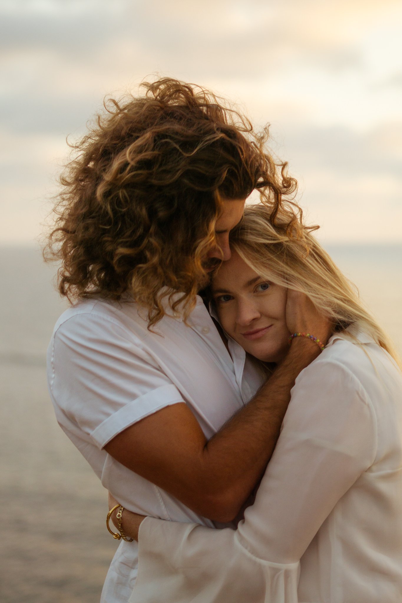 Man is holding woman tight