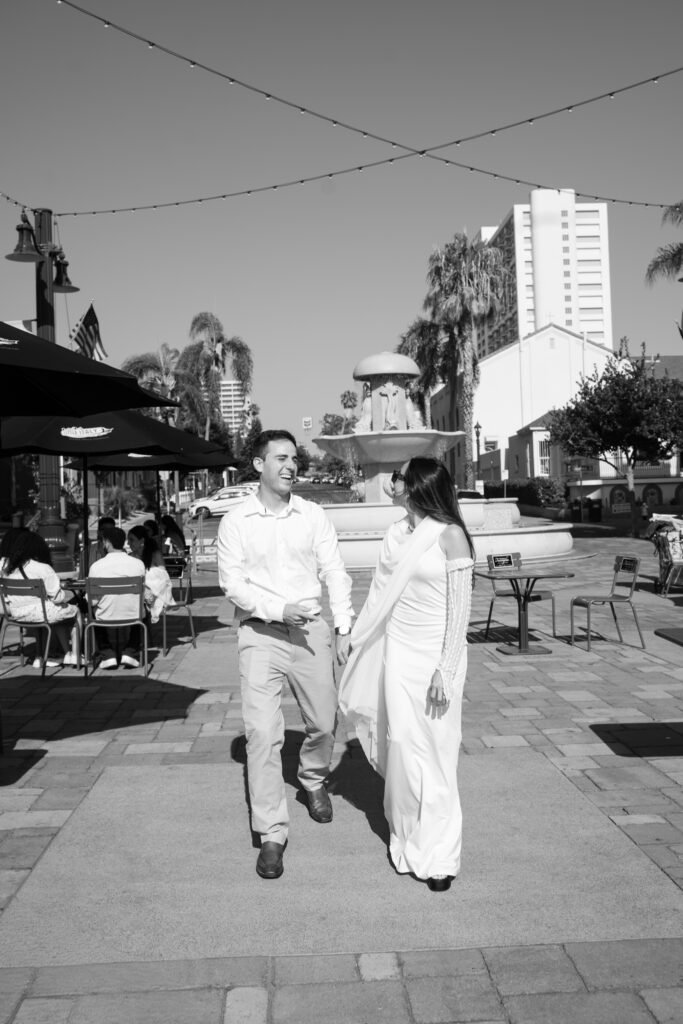 couple is walking and holding hands, black and white picture