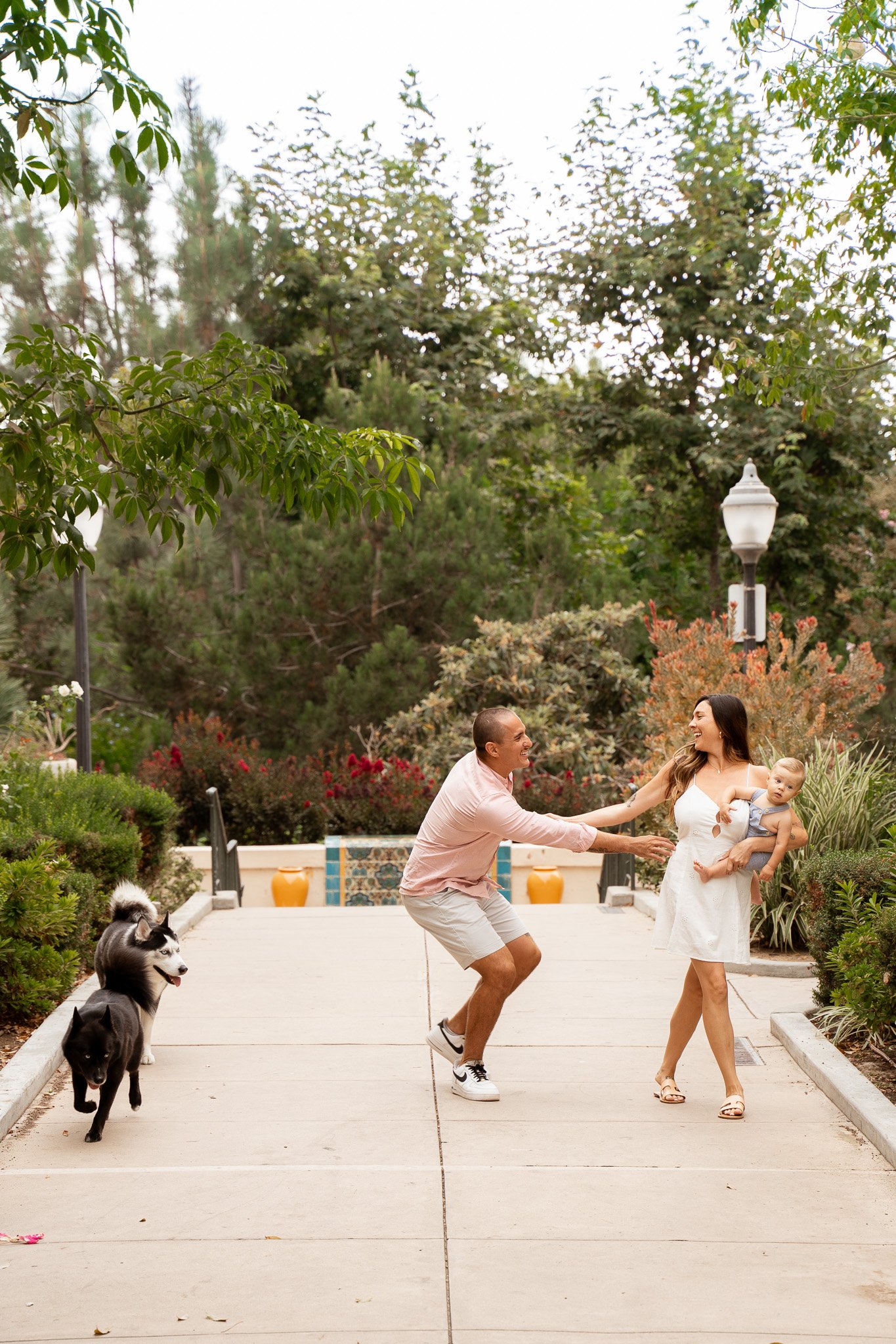 family havig fun at balboa park with dogs