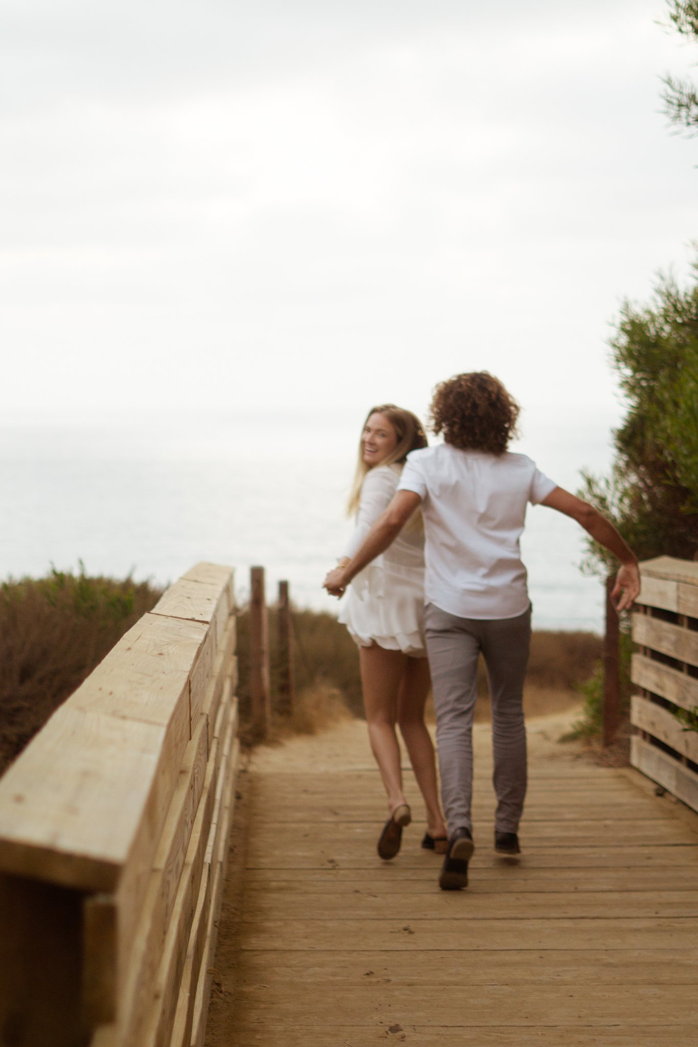 Man is running after woman on bridge